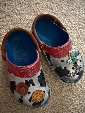 CROCS Kids Cow-Print Clogs with Red Trim and Blue Insole
